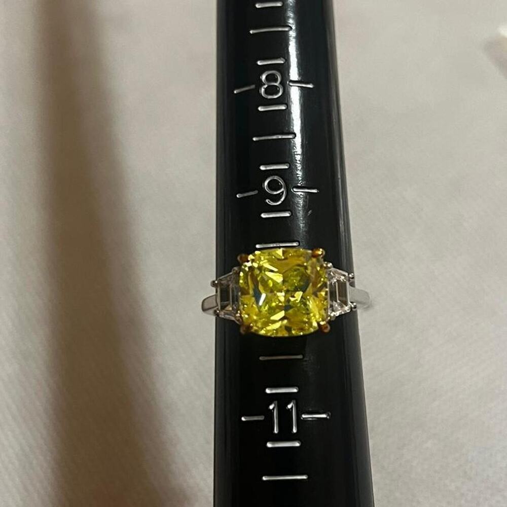 Canary yellow center stone ring